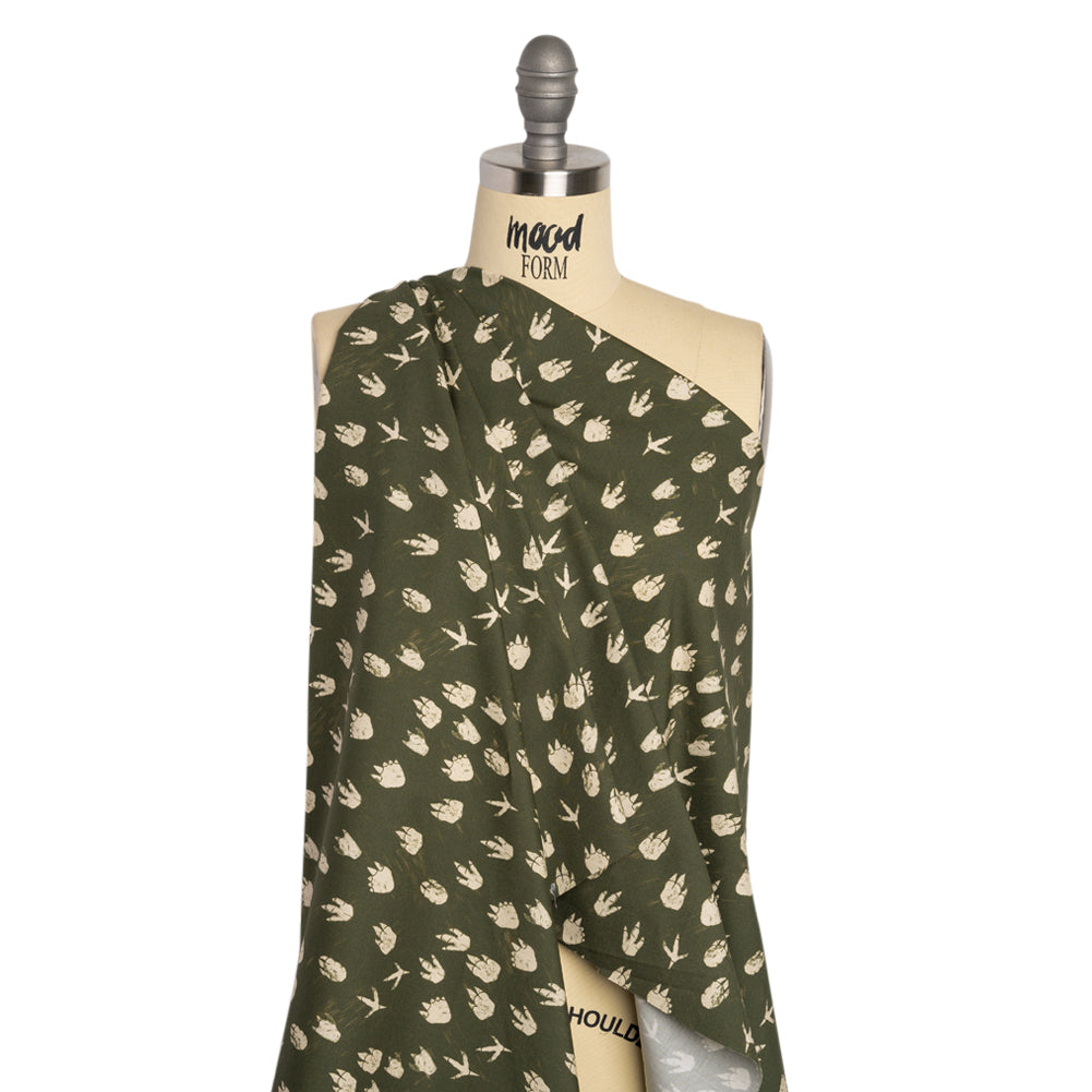 Stretch Cotton Poplin Print - Dark Olive Dinosaur Footprints - Mood Exclusive Jurassic Jubilee Drape