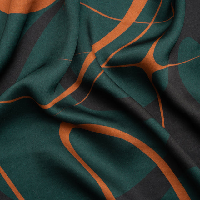 Sustainable and Recycled Viscose Satin Print - Forest Green and Orange Swirling Abstract - Mood Exclusive Atmospheric Adventure