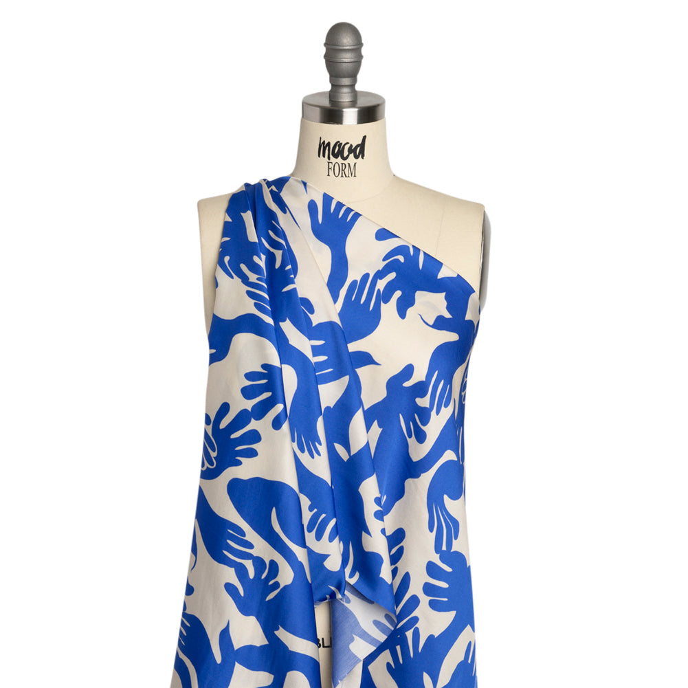Sustainable and Recycled Viscose Satin Print - Blue and White Hands - Mood Exclusive Helping Hands Detail