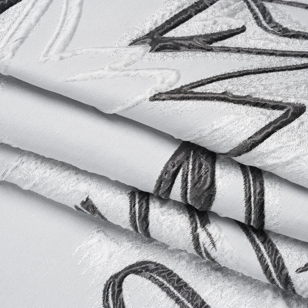 Metallic Polyester and Acetate Brocade - Silver, Charcoal and White Abstracted Flower Outlines Folded