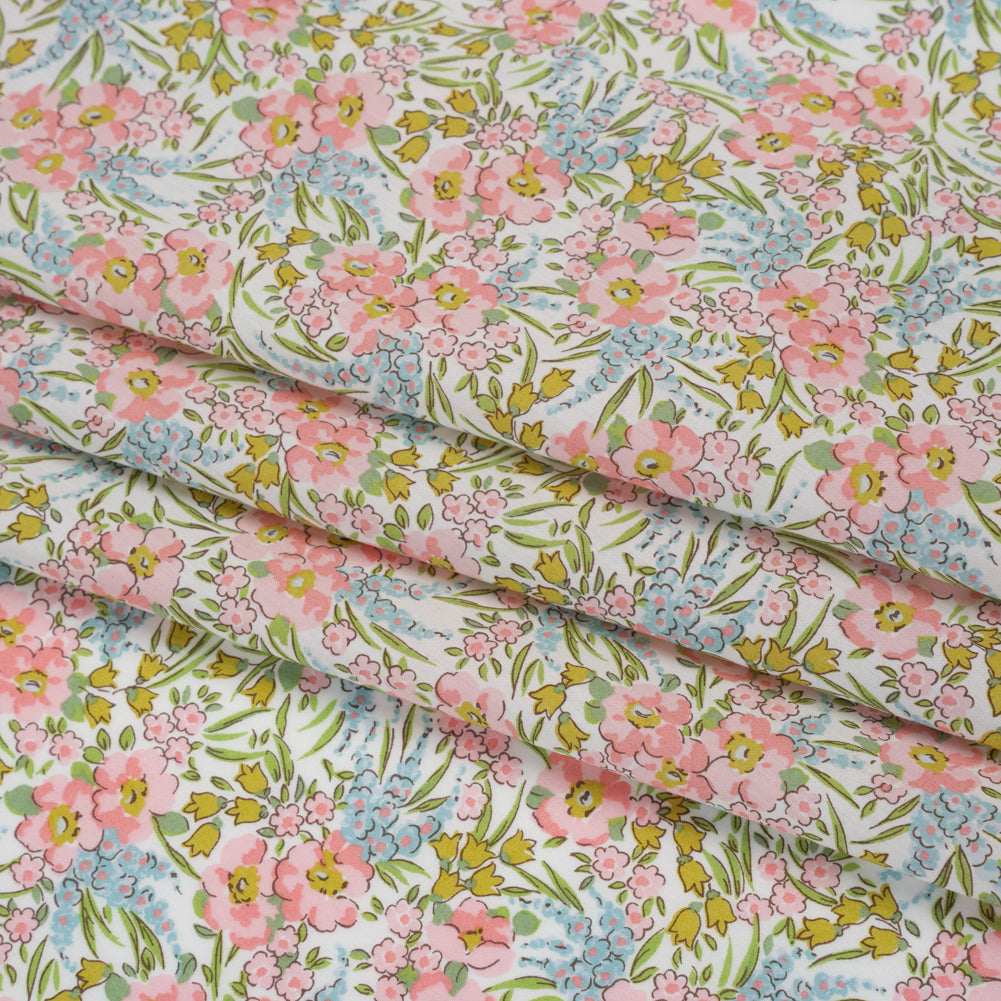 Liberty Fabrics Tana Lawn® - Swirling Petals Light Pink - Baby Pink, Blue and Yellow Green Floral Folded