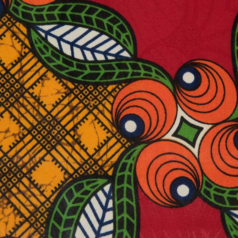 Red, Orange and Green Waxed Cotton African Print with additional Inlaid Pattern - Detail