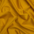 Famous Australian Designer Goldenrod Shimmering Stretch Polyamide Tricot | Mood Fabrics