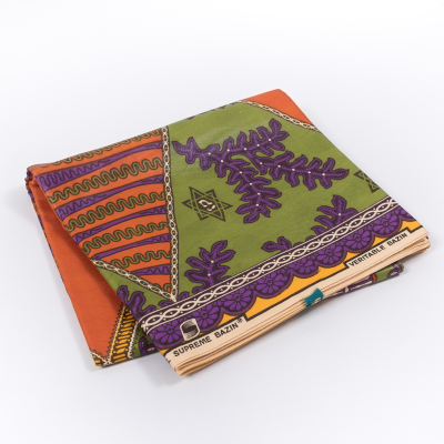 Orange, Purple and Green Waxed Cotton African Print with additional Inlaid Pattern | Mood Fabrics