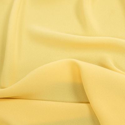 Premium Suzie Dark Yellow Polyester 4-Ply Crepe | Mood Fabrics