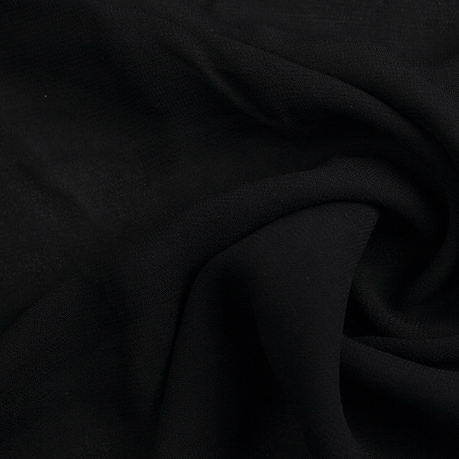 Famous Designer Black Stretch Viscose Georgette | Mood Fabrics