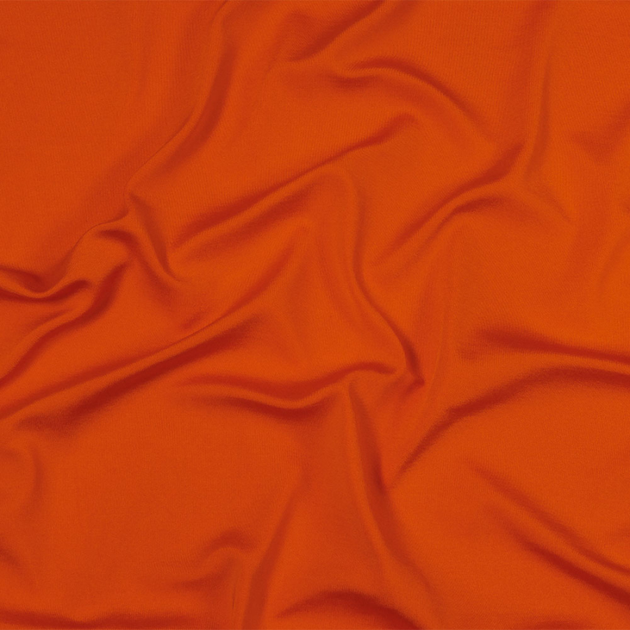 Carrot Luminous Stretch Polyester Tricot | Mood Fabrics