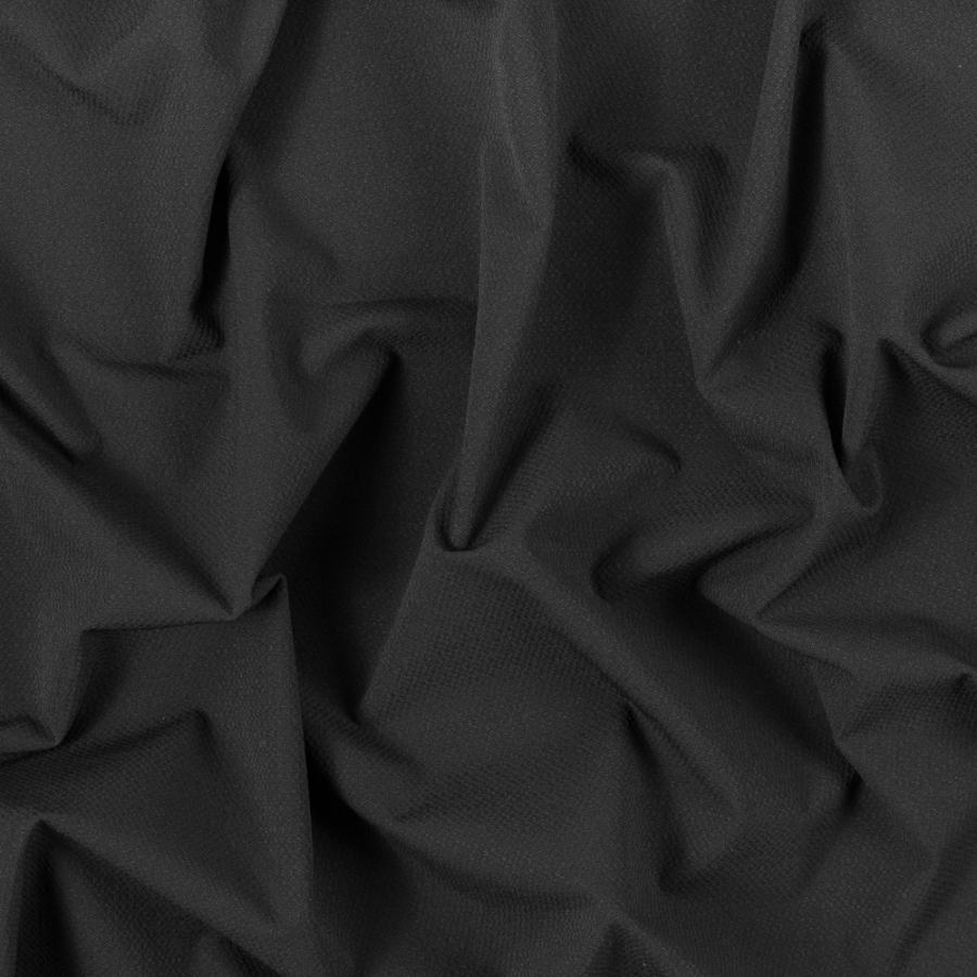 Black Textural Polyester Knit with Wicking Capabilities | Mood Fabrics