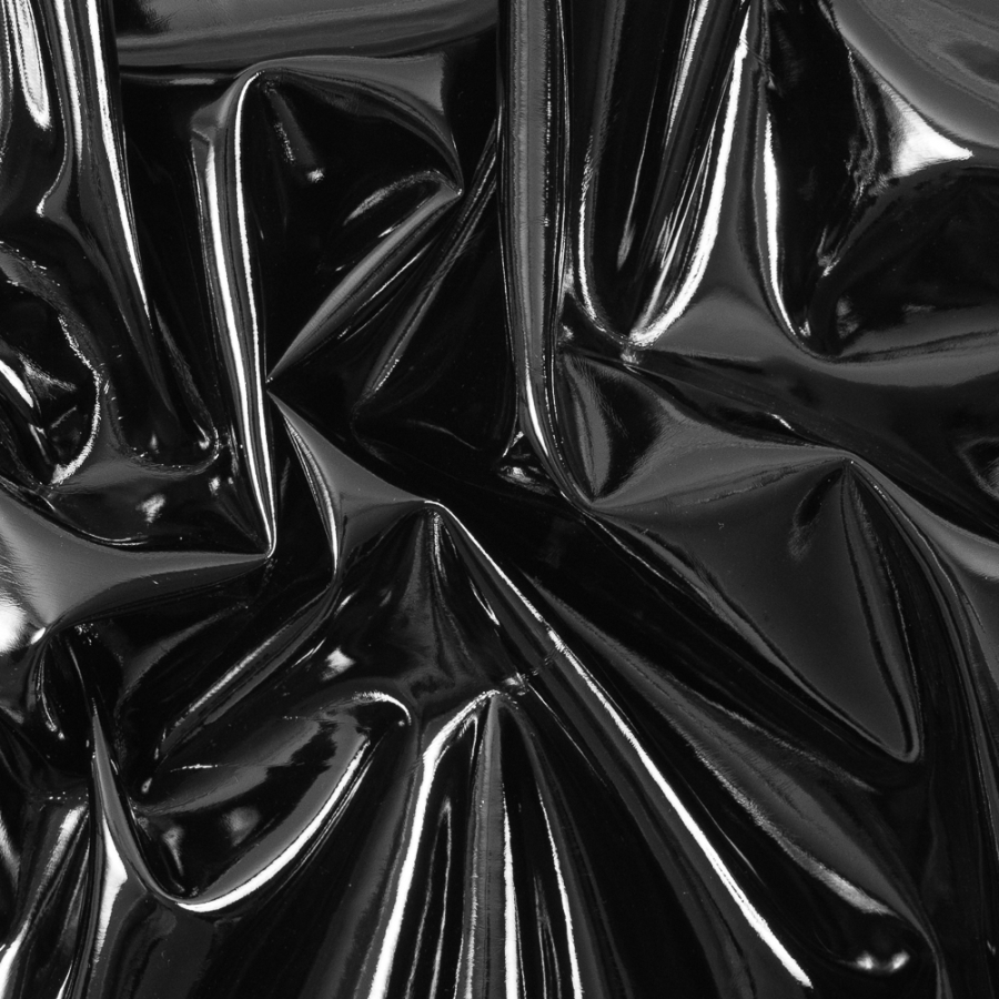 Black Wrinkled Faux Patent Leather with a Navy Fabric Backing | Mood Fabrics