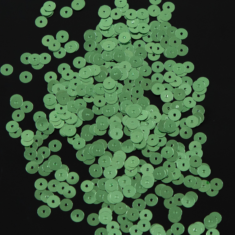 Bag of Green Color Loose Sequins with Silver Back - 5mm | Mood Fabrics