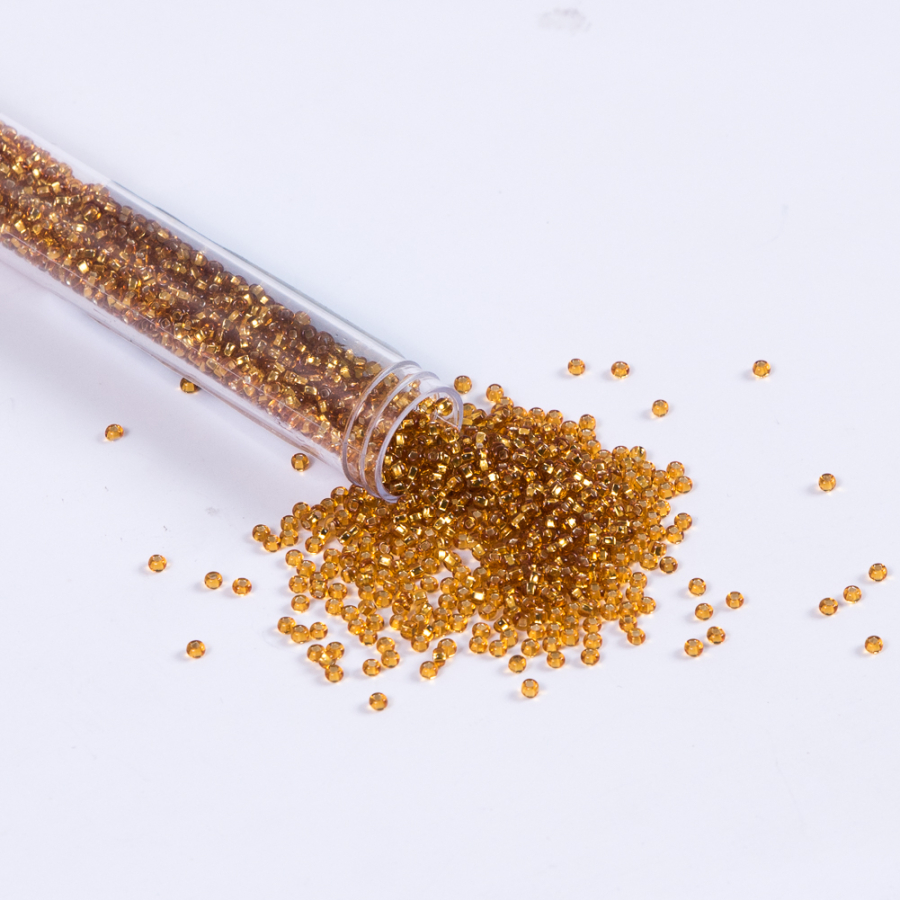 Gold Clear Czech Seed Beads - Size 10 | Mood Fabrics