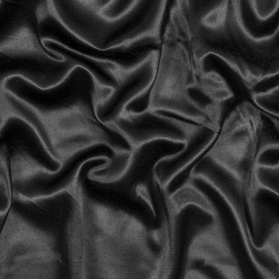 Black Solid Satin with Midnight Navy Backing | Mood Fabrics