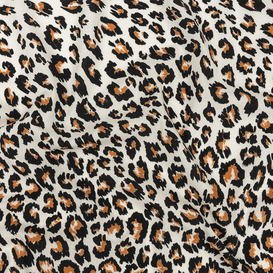 Mood Exclusive Ivory and Caramel Predator's Pride Cotton Poplin | Mood Fabrics