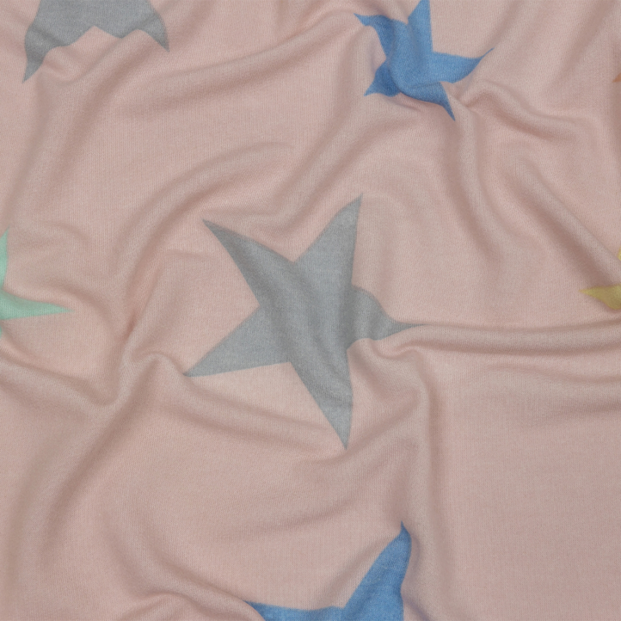 Pink and Rainbow Stars Stretch Polyester and Rayon French Terry | Mood Fabrics
