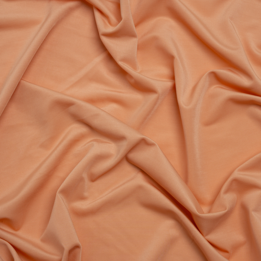 Famous Australian Designer Peach Stretch Polyester Jersey | Mood Fabrics