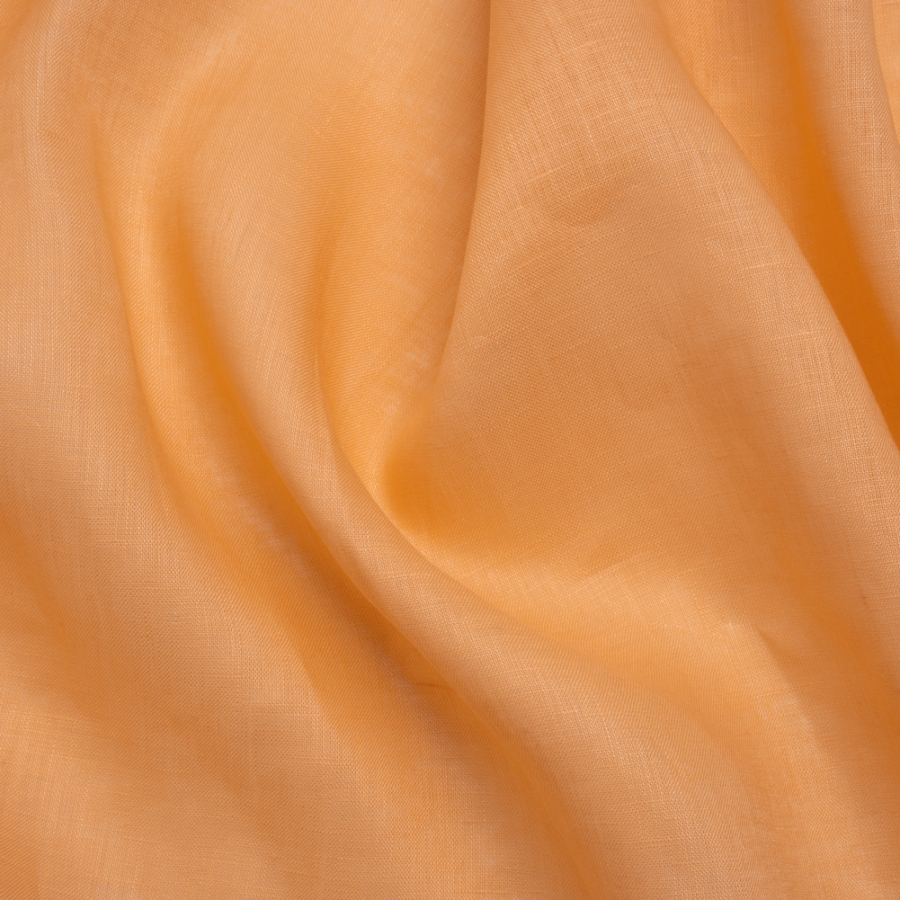 Famous Australian Designer Creamsicle Lightweight Linen Woven | Mood Fabrics