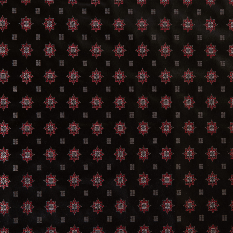Famous Designer Black and Red Laminated Woven | Mood Fabrics