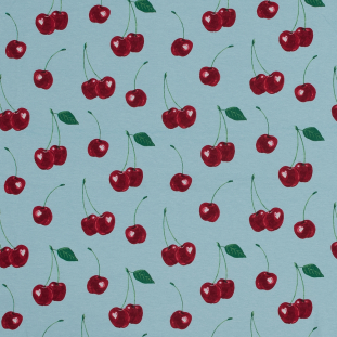 Cherries Printed on a Blue Cotton Jersey