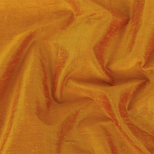 Golden Orange Iridescent Silk Dupioni with White Polyester and Cotton Jersey Backing