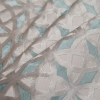 Turkish Aqua Geometric Laser Cut Velvet - Folded | Mood Fabrics