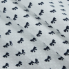 White and Navy Bow Printed Cotton Dobby Jacquard - Folded | Mood Fabrics