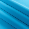 1.5mm Turquoise Solid Stretch Neoprene - Folded | Mood Fabrics