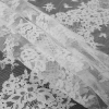 White Floral Fancy Corded Lace with Scalloped Eyelash Edges - Folded | Mood Fabrics