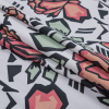 European Coral and White Geometric Floral Cotton Poplin - Folded | Mood Fabrics