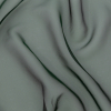 Shimmering Emerald and Black Iridescent Organza | Mood Fabrics