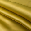 Luminous Rich Gold Satin-Faced Twill Organza - Folded | Mood Fabrics