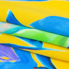 Italian Gamboge and Blue Floral Digitally Printed Silk Charmeuse - Folded | Mood Fabrics