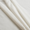 Egret White Polyester Weft Knit Fusible Interfacing - Folded | Mood Fabrics