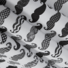 Black and White Mustaches Digitally Printed on Stretch Neoprene/Scuba Knit - Folded | Mood Fabrics