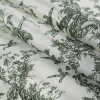 Oil Green/White Conversational Printed Polyester Lining - Folded | Mood Fabrics