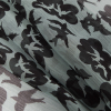 Famous Designer Green/Black Turtledoves Printed on a Crinkled Silk Chiffon - Folded | Mood Fabrics