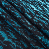Black and Metallic Aqua Ikat Brocade - Folded | Mood Fabrics