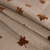 Beige and Gray Fused Double-Cloth Flocked with Brown Leaves - Folded | Mood Fabrics