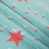 Emberglow Printed Stars on an Aqua Sky Polyester Woven - Folded | Mood Fabrics