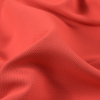 Neon Orange Polyester and Bamboo Wicking Fabric - Detail | Mood Fabrics