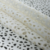Off-White Laser-Cut Scuba Knit Neoprene | Mood Fabrics