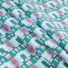 Green and Pink Geometric Printed Cotton Woven - Folded | Mood Fabrics