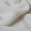 Whisper White Solid Boiled Wool - Detail | Mood Fabrics