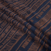 Brown and Navy Abstract Printed Polyester Chiffon - Folded | Mood Fabrics