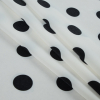Winter White and Black Polka Dotted Polyester Lining - Folded | Mood Fabrics