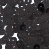 Bag of Black Transparent Bright Loose Sequins - 6mm - Detail | Mood Fabrics