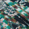 Italian Navy and Green Geometric Ikat Printed Jersey - Folded | Mood Fabrics