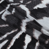 Italian Black and Brown Abstract Viscose Jersey - Folded | Mood Fabrics