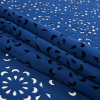 Blue Floral Laser-Cut Scuba Knit Neoprene - Folded | Mood Fabrics