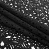 Black Floral Laser-Cut Suede Backed Scuba Knit - Folded | Mood Fabrics