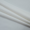 Coconut Milk Stretch Polyester Woven - Folded | Mood Fabrics